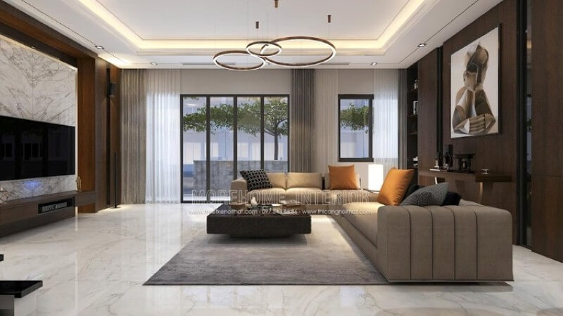 Mẫu trang trí nội thất phòng khách phong cách hiện đại tại biệt thự cao cấp Parkcity với ý tưởng trang trí đòi hỏi người thi công phải có năng lực chuyên môn cao: các tấm gỗ ốp tường phải được thi công một cách khéo léo, đèn âm trần, đèn treo tường trên nền trần thạch cao đã hoàn thiện, và một bộ sofa cách điệu. Nếu bạn đang muốn tìm kiếm ý tưởng phù hợp hãy tham khảo tại website Morehome:thietkenoithat.com Xu hướng thiết kế phòng khách tiện nghi
