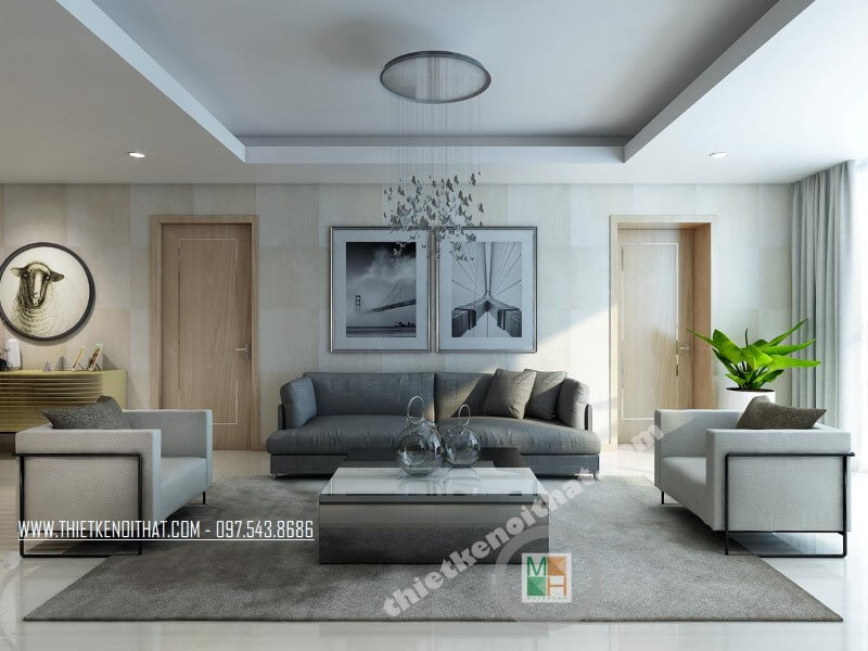 Mẫu thiết kế phòng khách chung cư hiện đại với bộ sofa bọc vài màu xám và trắng tạo điểm nhấn nổi bật cho căn phòng. “thiết