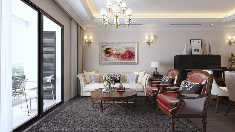 Phòng khách tân cổ điển với gam màu thật vintage của cặp ghế đơn sofa da màu đỏ khung gỗ với đường nét họa tiết hoàng gia mang Thiết kế phòng khách đẹp
