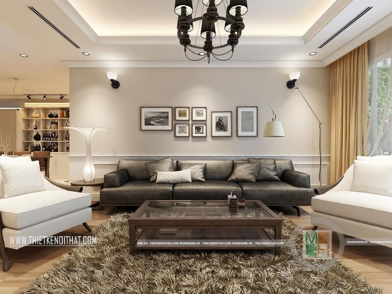 Mẫu thiết kế nội thất phòng khách sang trọng cho chung cư với bộ sofa da cao cấp màu đèn, trắng tạo điểm nhấn nổi bật cho căn phòng. Thiết kế phòng khách tại Hà Nội